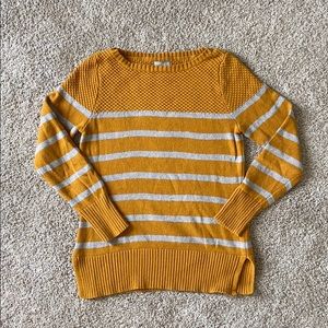 Mustard and gray sweater.